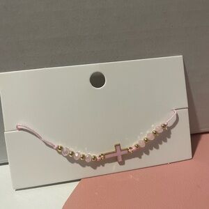 Cross Tie bracelet in the color Baby Pink